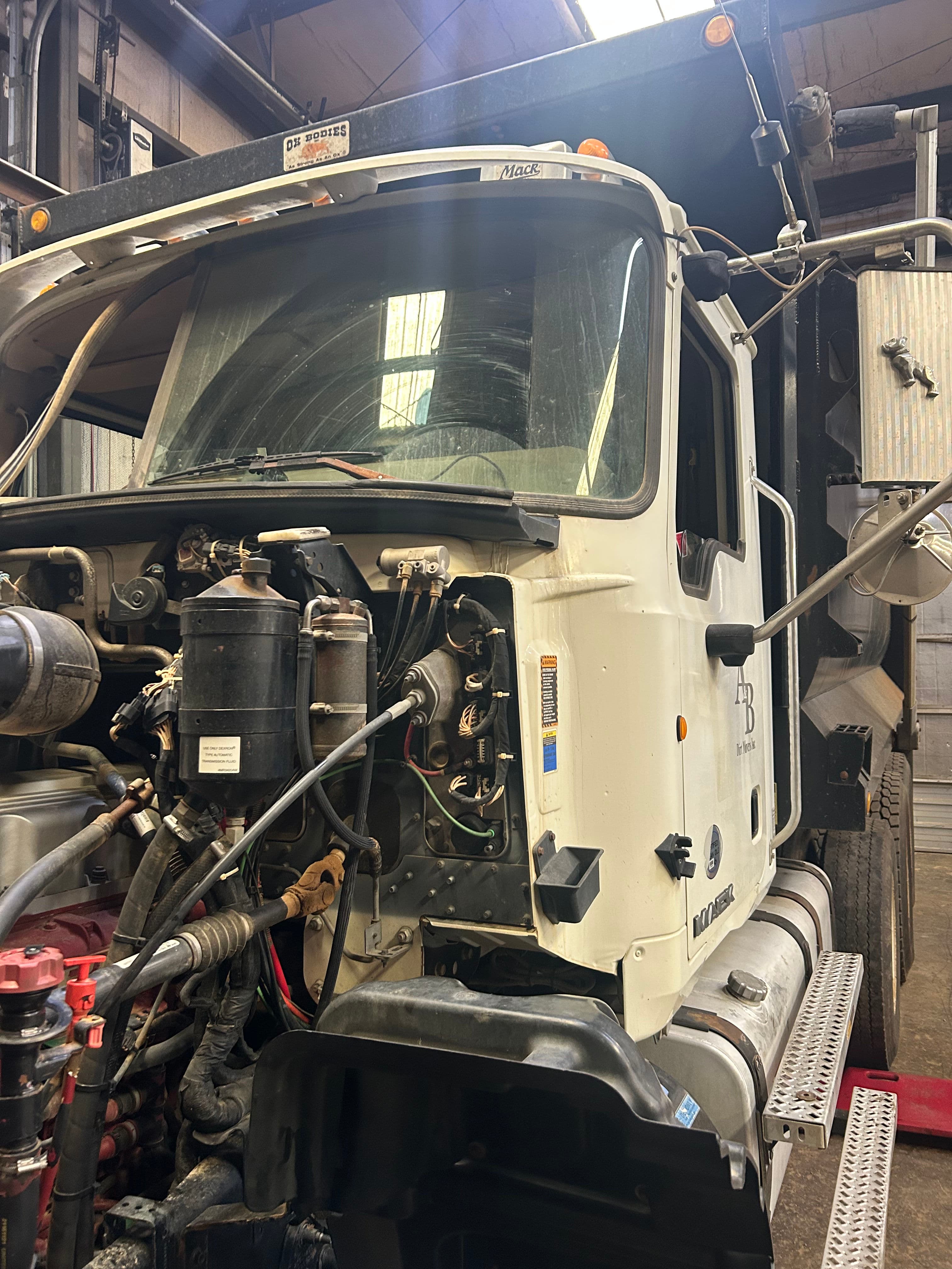 Project Heavy Duty Truck Windshield Work on a Mack With the Hood Up image